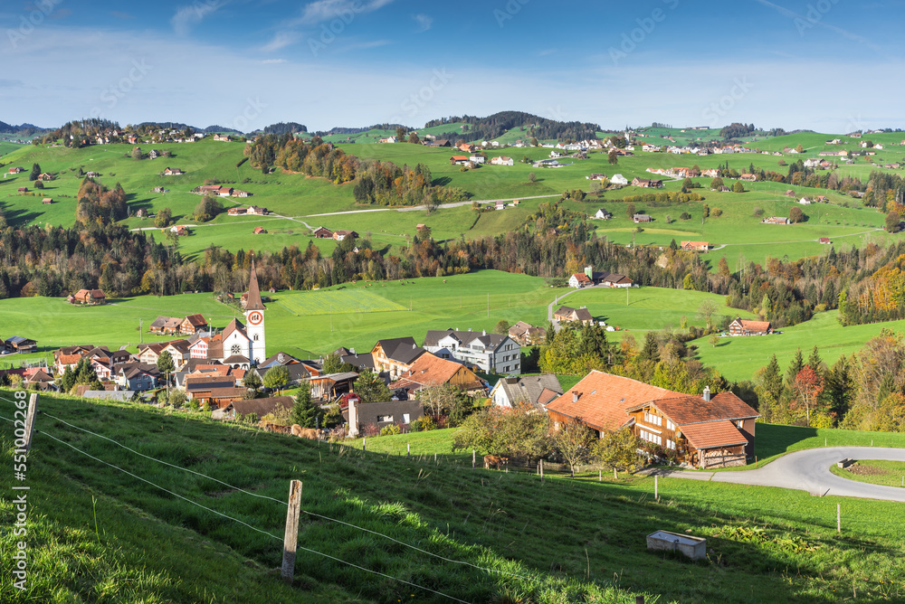 Typical hilly landscape in the Appenzellerland with villages, green meadows and pastures. Haslen, Canton Appenzell Innerrhoden, Switzerland