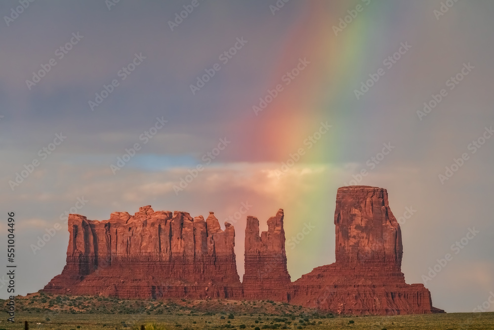 View of rainbow appearing after rain in Monument Valley Tribal Park, USA