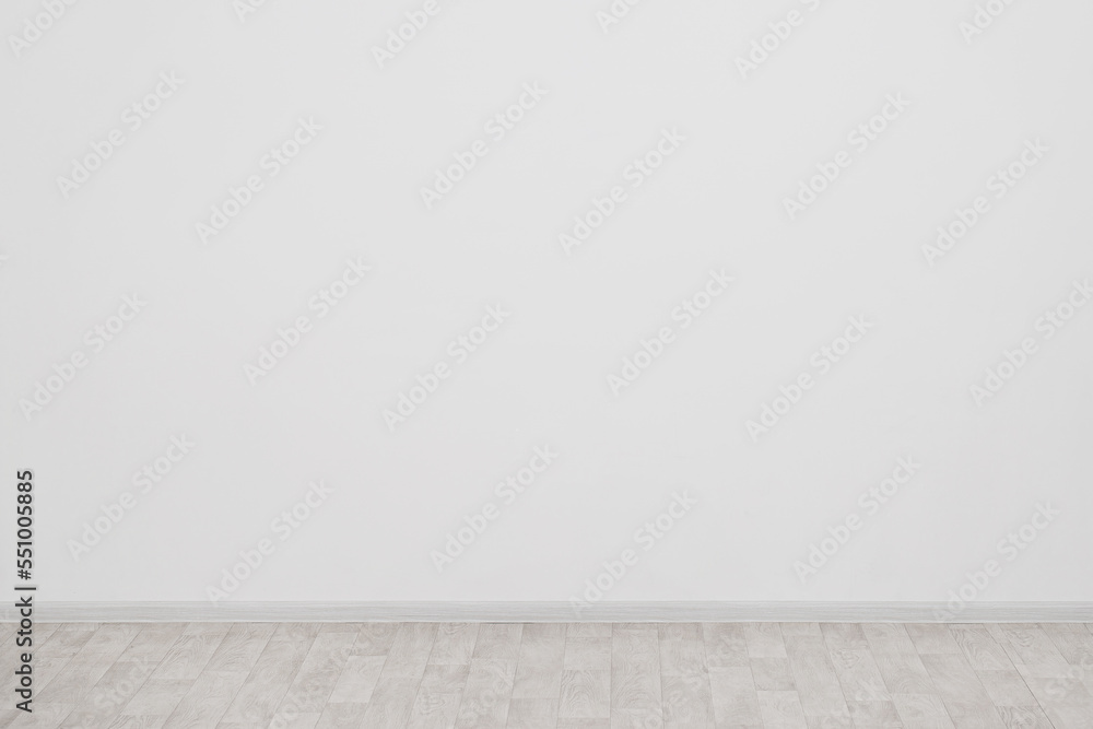 home interior of a room with parquet floor and gray wall home interior of a room with parquet floor and gray wall