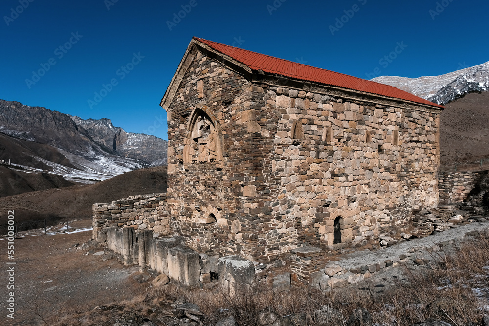 Old Ingush Christian temple Tkhaba-Erdy on sunny winter day. Ingushetia, Caucasus, Russia.