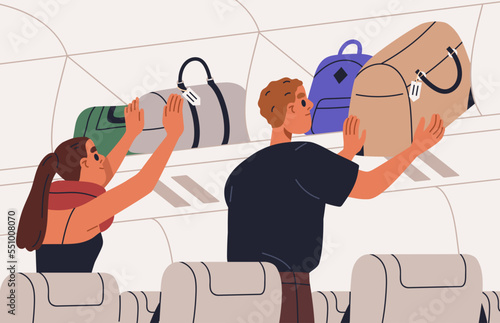 Passengers placing hand baggage, personal carry-on luggage on overhead bin, s...