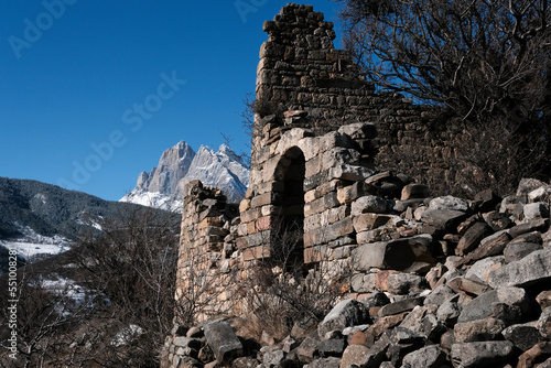 Ruins of old Ingush settlement near by temple Tkhaba-Erdy on sunny winter day. Ingushetia, Caucasus, Russia.