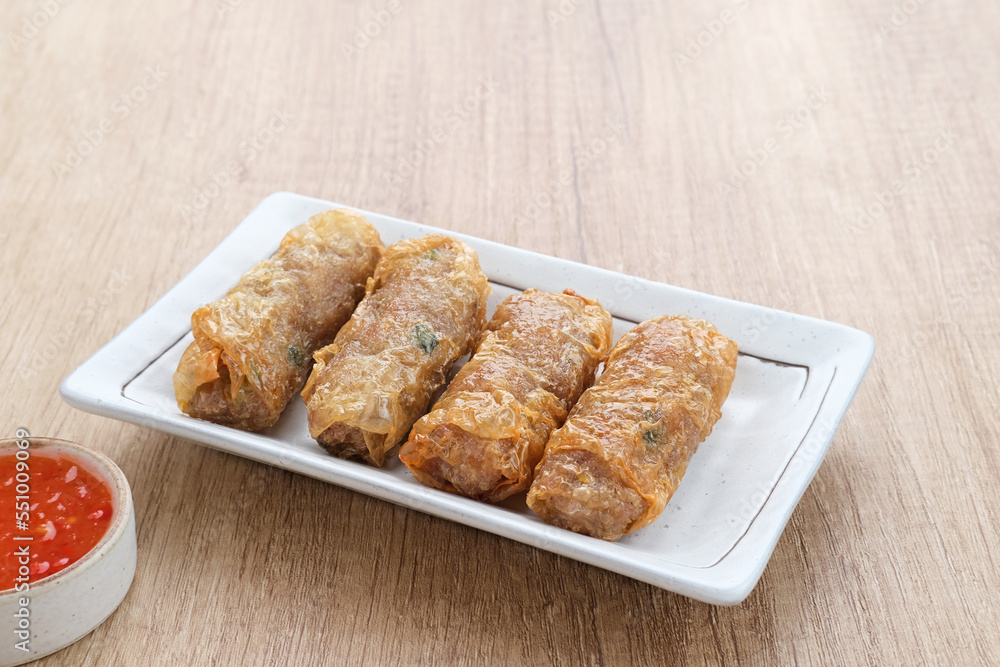 Lumpia Kulit Tahu, chicken shrimp spring rolls wrapped in tofu skin. Served with sauce.
Lumpia Kulit Tahu, chicken shrimp spring rolls wrapped in tofu skin. Served with sauce.