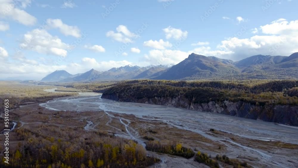 Sunny autumn day in Chugach State Park, Alaska. Aerial view of mountainous landscape with glacial Matanuska River. Sunny autumn day in Chugach State Park, Alaska. Aerial view of mountainous landscape with glacial Matanuska River.