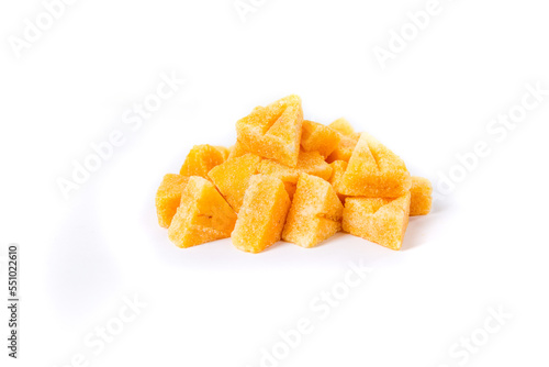 Saffron spiced sugar cubes in a pile isolated over white