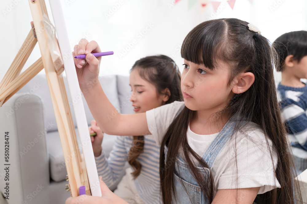 Asia daughter and mother learn painting at home Asia daughter and mother learn painting at home