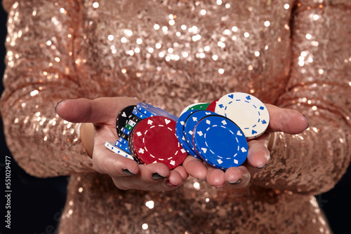 Casino concept. Portrait of young pretty caucasian woman, playing in casino. Roulette, poker chips, cards, wheel, isolated white background photo