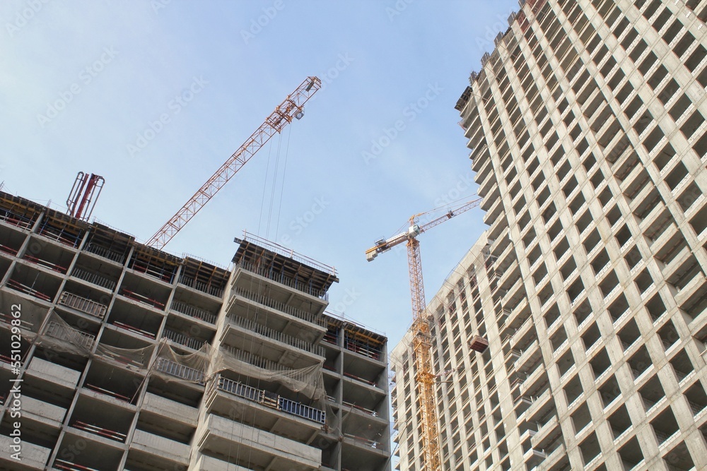 Crane and building construction site. Industry modern new civil house business. Concept of development improvement town. Architecture planning of a city. Renovation project. Residential area