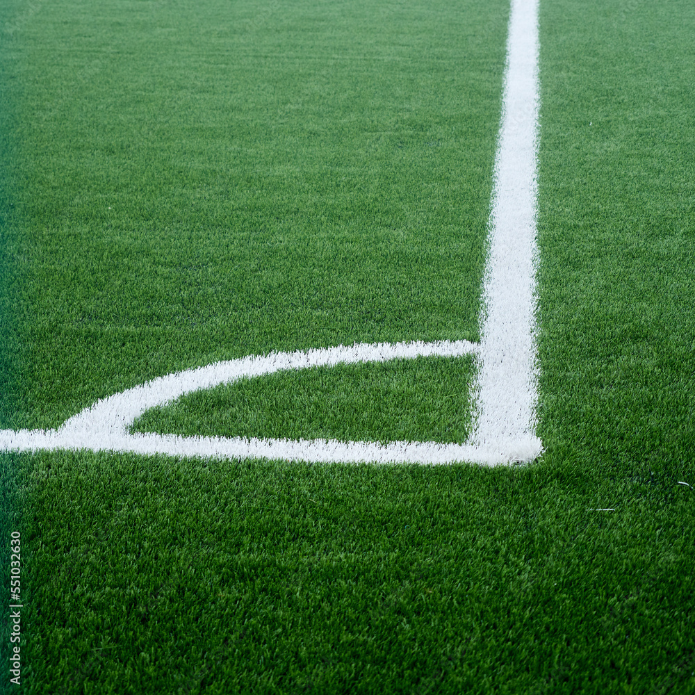 football field in the fog. green lawn and football field markings