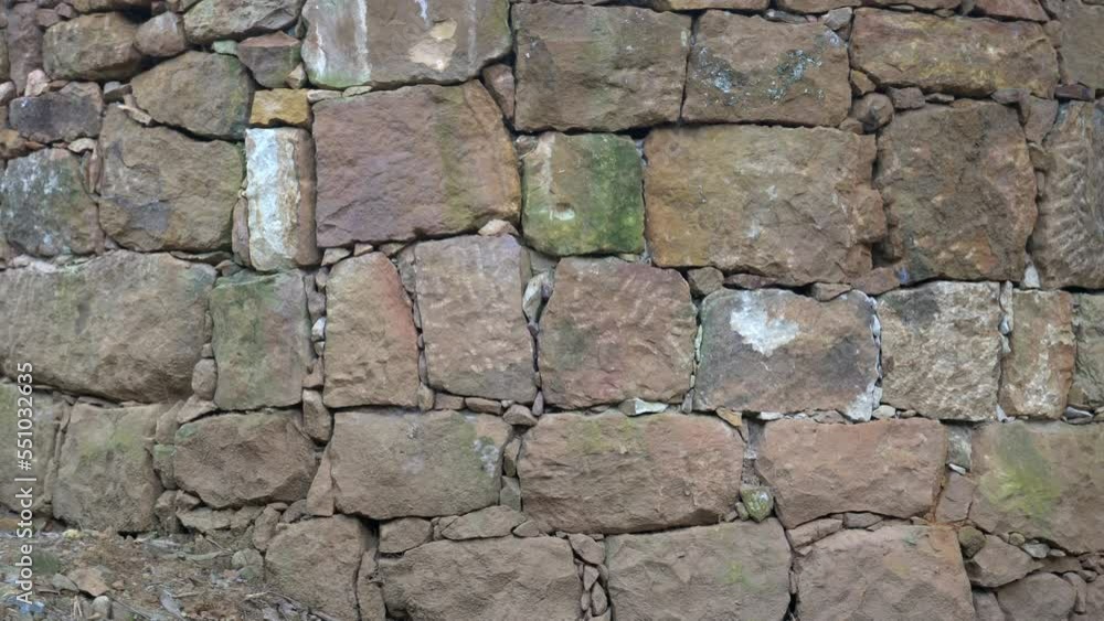 August 2022 - Barichara to Guane pilgrimage - Colombia South America - walls made with cooked dry earth and stones according to the ancient tradition of the natives - tree goes through the wall August 2022 - Barichara to Guane pilgrimage - Colombia South America - walls made with cooked dry earth and stones according to the ancient tradition of the natives - tree goes through the wall