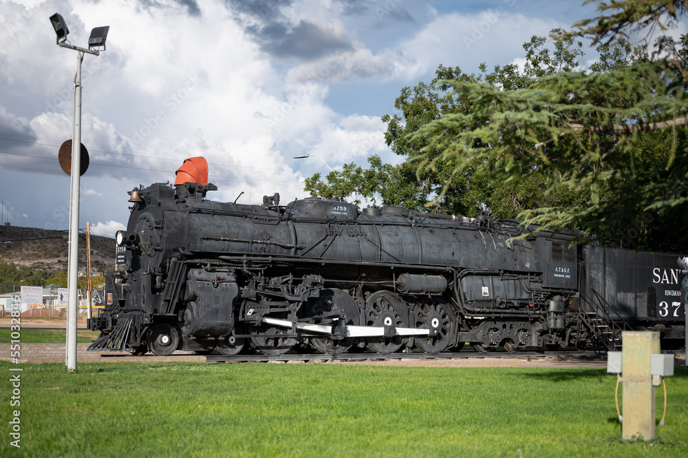 Fototapeta premium Old steam train machine exposed in a town in the United States
