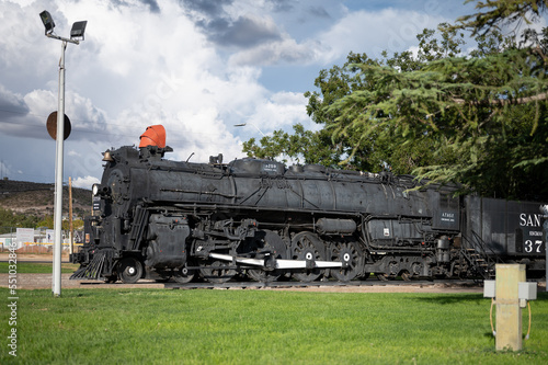 Old steam train machine exposed in a town in the United States photo