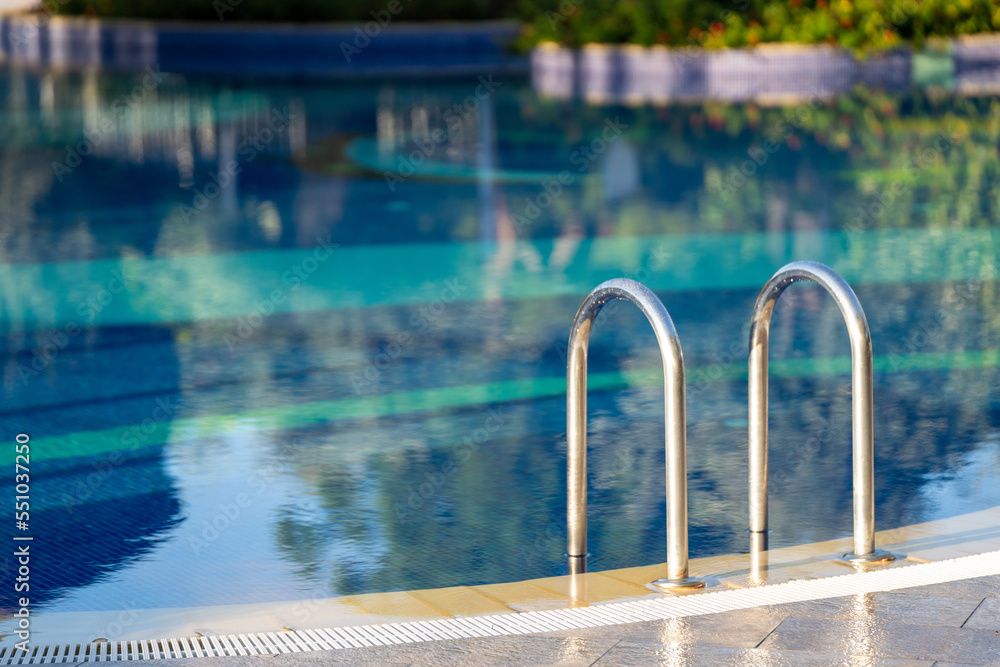 Ladder by the Clean Swimming Pool