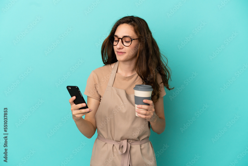 Restaurant waiter holding coffee to take away and a mobile Restaurant waiter holding coffee to take away and a mobile