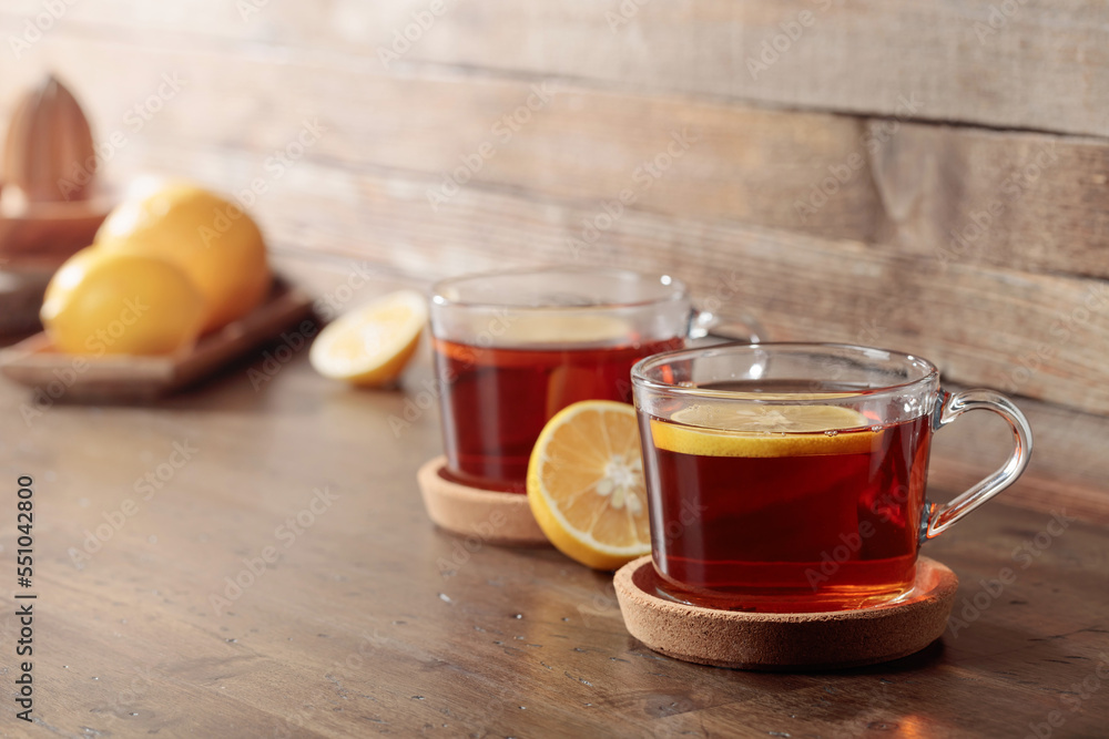 Tea with lemon on a wooden table. Tea with lemon on a wooden table.
