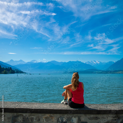 Traveler woman looking at beautiful lake and alps mountain- Switzerland