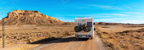Motorhome on desert road- Bardenas reales in Spain