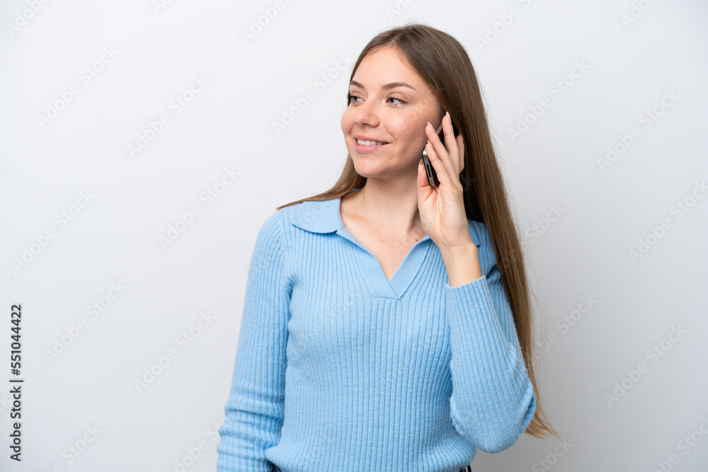Young Lithuanian woman isolated on white background keeping a conversation with the mobile phone with someone Young Lithuanian woman isolated on white background keeping a conversation with the mobile phone with someone