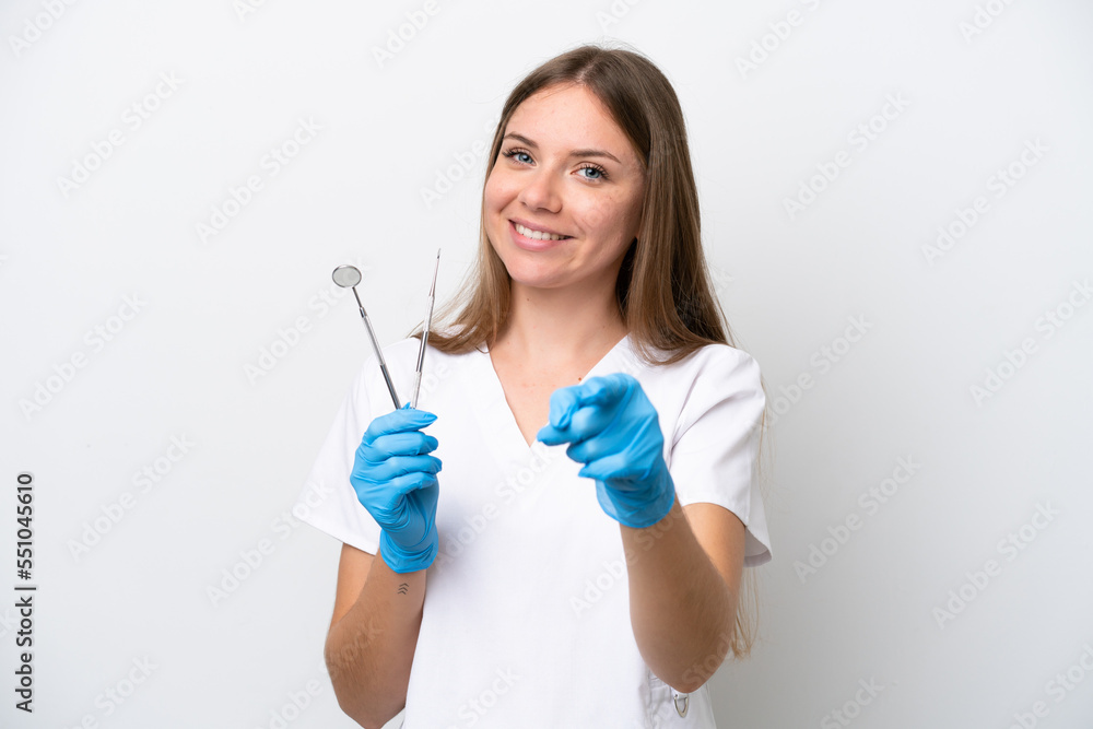 Dentist woman holding tools isolated on white background pointing front with happy expression Dentist woman holding tools isolated on white background pointing front with happy expression