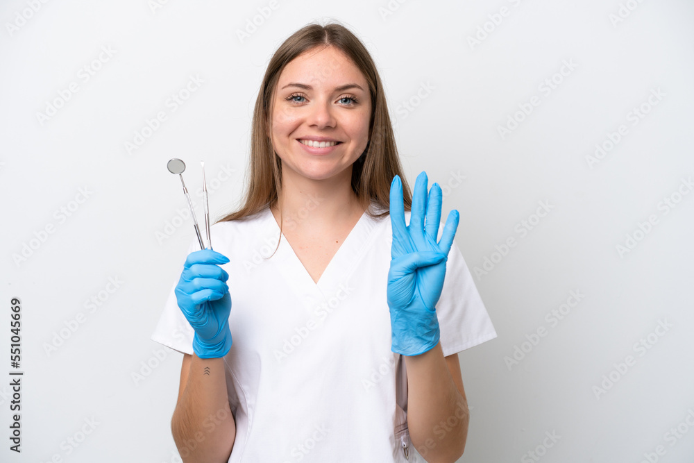 Dentist woman holding tools isolated on white background happy and counting four with fingers Dentist woman holding tools isolated on white background happy and counting four with fingers