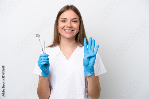 Dentist woman holding tools isolated on white background happy and counting four with fingers