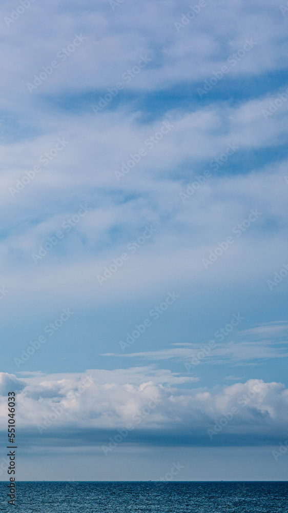 BANNER, VERTICAL STORY Atmosphere panorama white cloud clear blue sky horizon line calm empty sea. Concept paradise life. Design relax wallpaper background. More tone format in stock