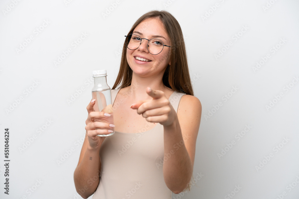 Young Lithuanian woman with a bottle of water isolated on white background points finger at you with a confident expression Young Lithuanian woman with a bottle of water isolated on white background points finger at you with a confident expression