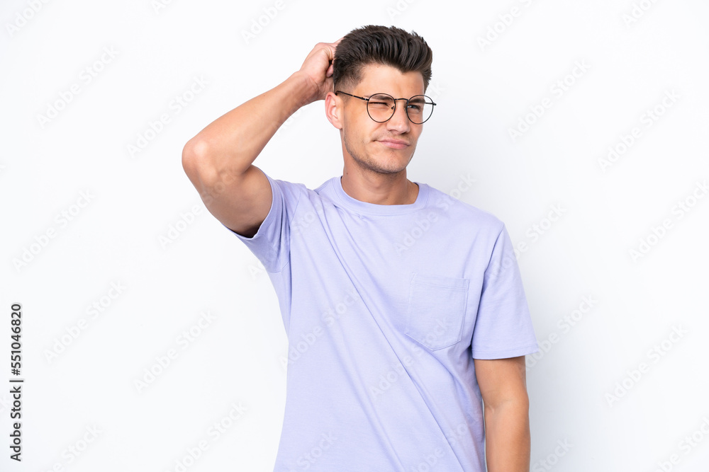 Young caucasian man isolated on white background having doubts while scratching head Young caucasian man isolated on white background having doubts while scratching head
