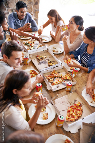 Canvas Print Pizza, restaurant and friends party at table eating together with social, communication and conversation for reunion or celebration
