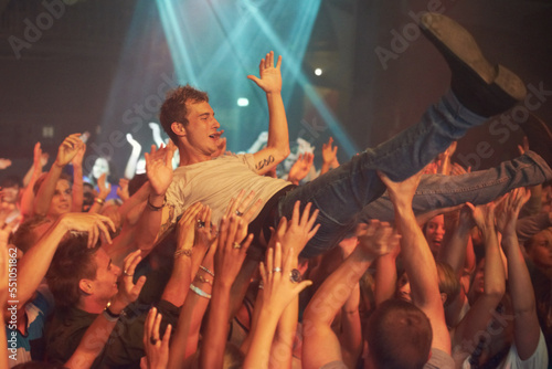 Photography Music, party and crowd surfing with man at concert for rock, celebration and festival