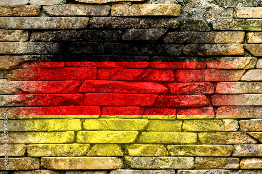 Flag of Germany. Flag is painted on a stone wall. Stone background. Copy space. Textured background Flag of Germany. Flag is painted on a stone wall. Stone background. Copy space. Textured background
