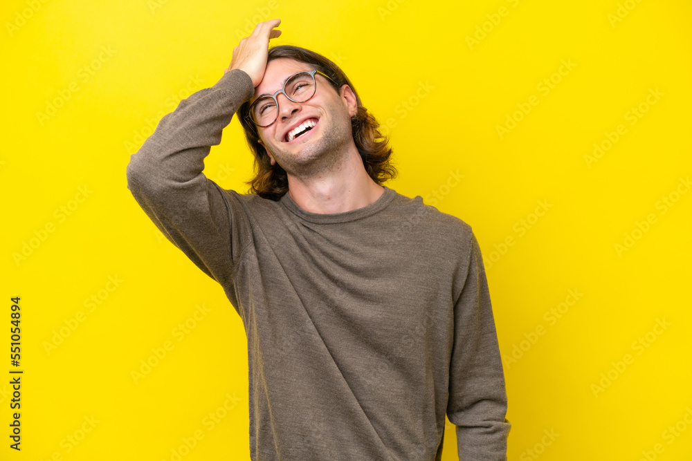 Caucasian handsome man isolated on yellow background has realized something and intending the solution Caucasian handsome man isolated on yellow background has realized something and intending the solution
