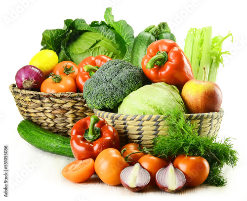 Mixed raw vegetables on display in a wicker basket