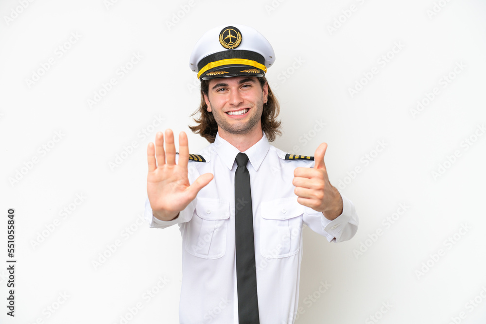 handsome Airplane pilot isolated on white background counting six with fingers