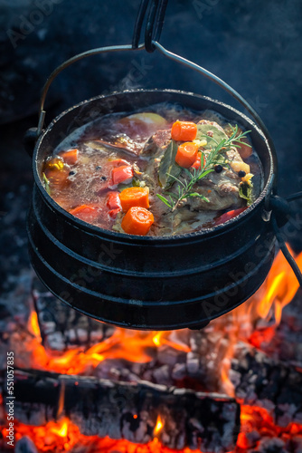 Delicious and hot hunter's stew with herbs and vegetables.