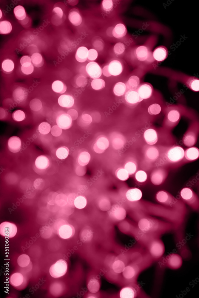 Viva magenta abstract background of blurred lights for design. Lights bokeh dis focus. Christmas background, copy space