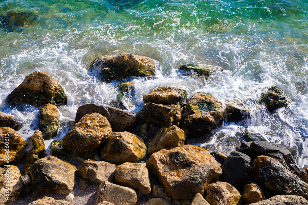 Rocks and sea water on the shore Rocks and sea water on the shore