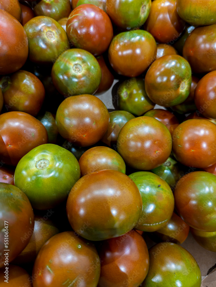fresh tomatoes in cardboard boxes in a supermarket ready for sale fresh tomatoes in cardboard boxes in a supermarket ready for sale