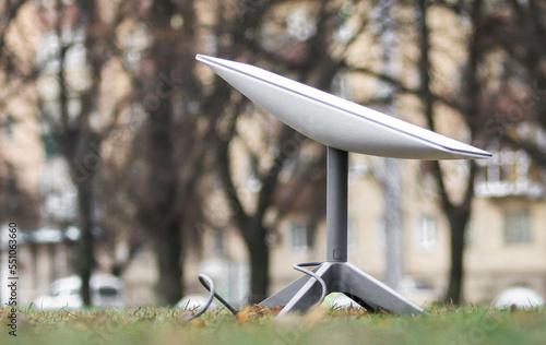 An antenna for receiving the Internet signal from space Starlink on the ground in the park