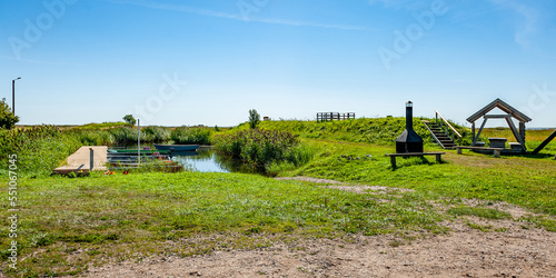 Picnic place next to the Baltic Sea in Lindi Nature Reserve with  furniture, swing and BBQ area. Kavaru sightseeing tower. Estonia. Baltic. Panorama. photo