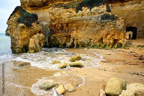 Camilo beach with characteristic cliffs and cave, near Ponta da Piedade, Lagos, Algarve, Faro district, Portugal, Europe photo