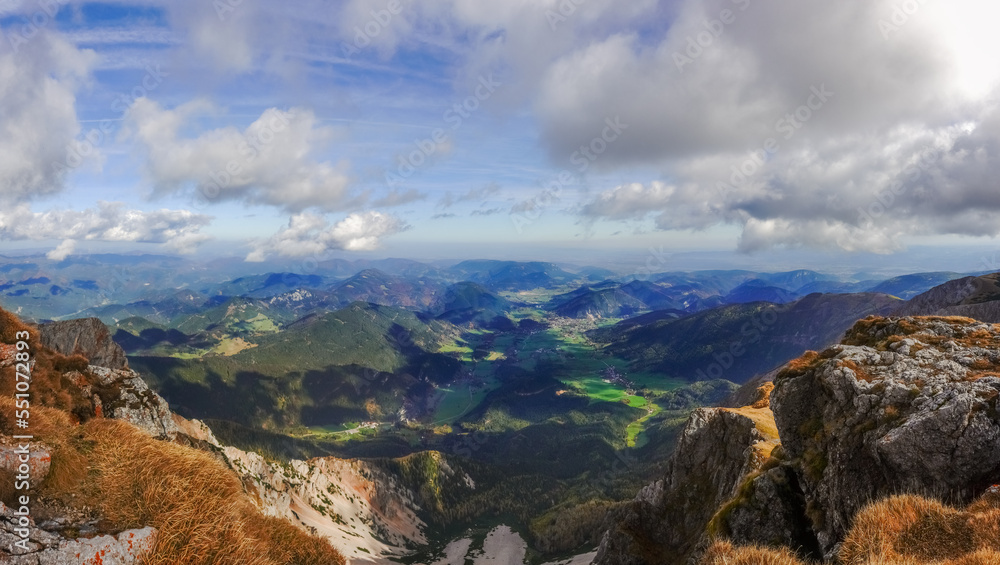 amazing wide view to a hilly mountain landscape and amazing sky during hiking panorama