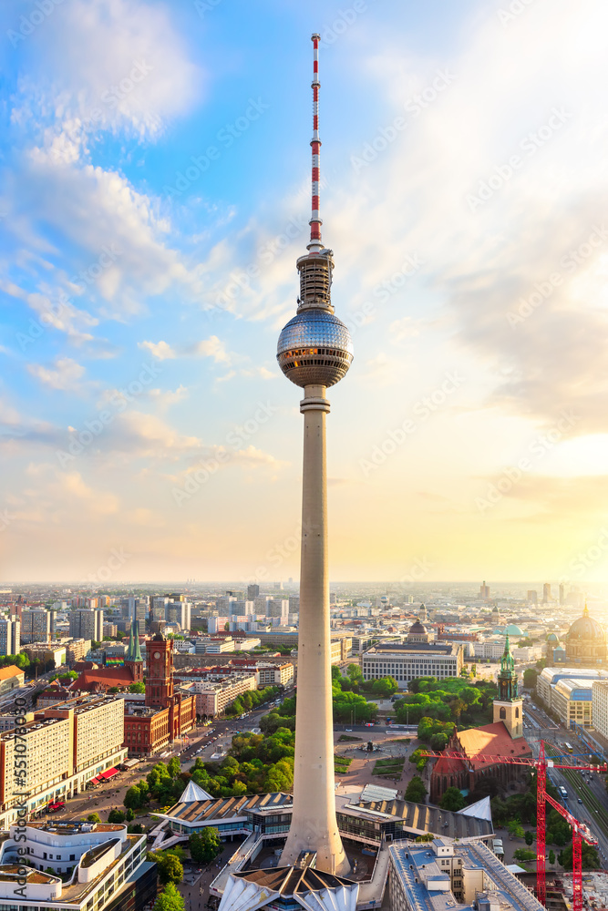 skyline panorama of Berlin with Red City Hall and TV Tower at sunset, Germany