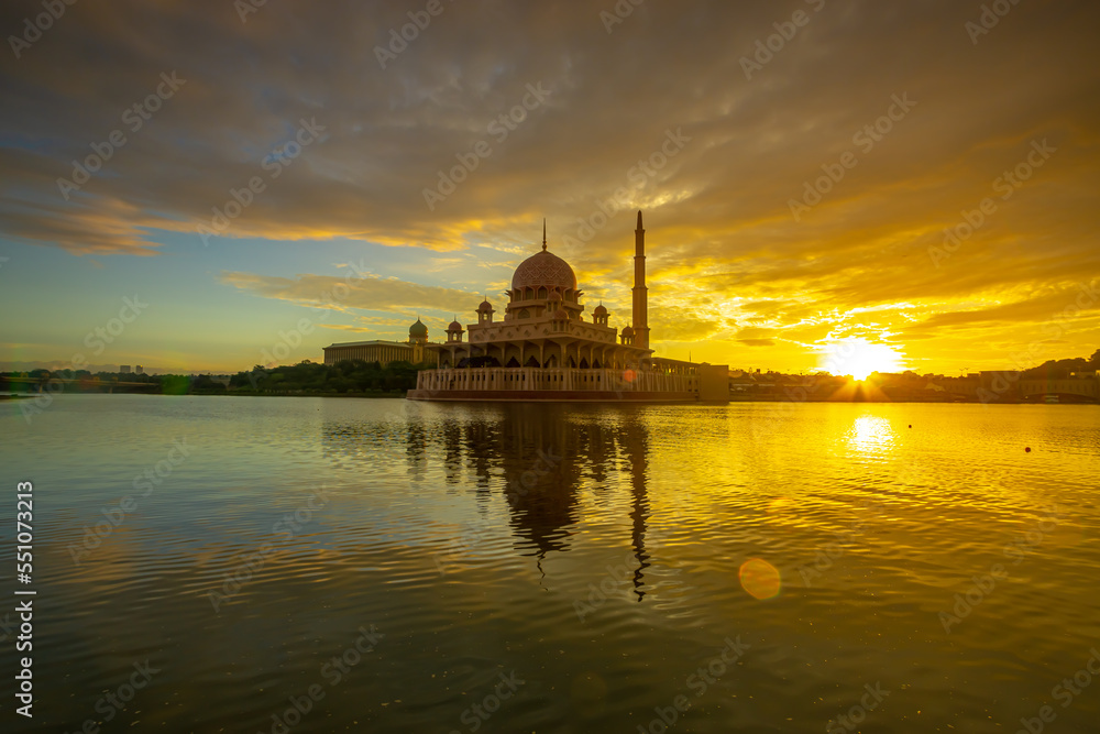 Morning scene at Putra Mosque in putrajaya with reflection cloud and sky.