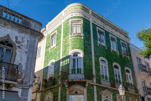 Green house tiled building in Luis de Camoes square in the historic center of Lagos city town in Algarve, Portugal.