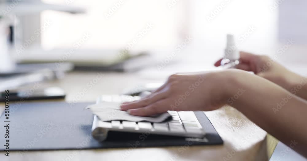 Hands, sanitizer and cleaning dust on keyboard at office desk for bacteria, virus or hygiene for health and safety. Worker spraying or wipes messy or dirty computer equipment for a healthy workspace Hands, sanitizer and cleaning dust on keyboard at office desk for bacteria, virus or hygiene for health and safety. Worker spraying or wipes messy or dirty computer equipment for a healthy workspace
