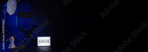 Director chair with cinema lightbox sign Director text on it and clapperboard megaphone and black background studio. Director seat on video production or filming set used in film industry. Real no 3D