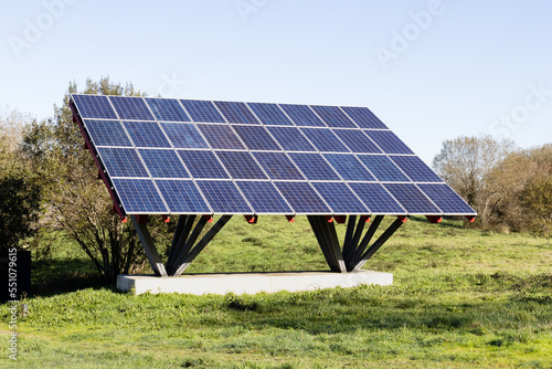 Solar panels installed on a metal built structure in a field