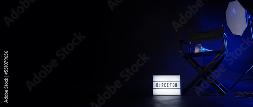 Director chair with cinema lightbox sign Director text on it and clapperboard megaphone and black background studio. Director seat on video production or filming set used in film industry. Real no 3D