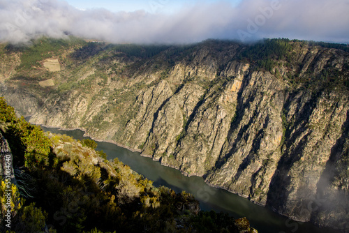 Cañon del Sil. Dramatic landscape view of the Canyon of Sil in Ribeira Sacra, well know area for it's terraced vineyards on the cliffs for the production of Mencia wine. Ourense, Galicia, Spain photo